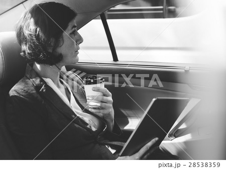 Businesswoman Using Tablet Car Inside Businesswoman Using Tablet Car Inside 28538359