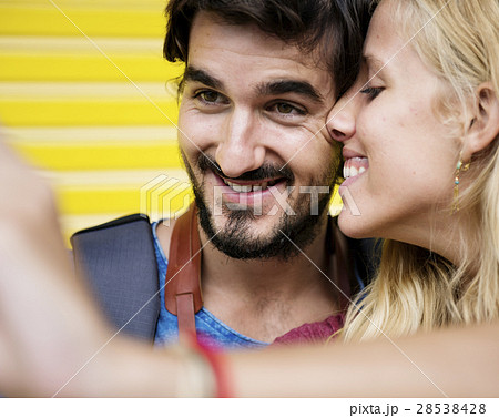 Couple taking a sweet mobile selfie 28538428