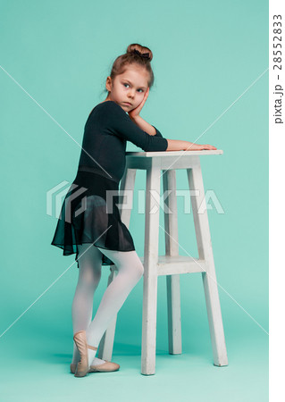 The little balerina dancer on blue background The little balerina dancer on blue background 28552833