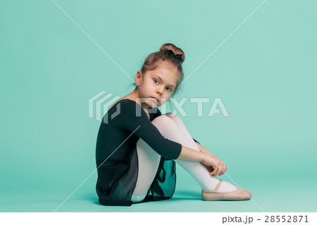 The little balerina dancer on blue background 28552871