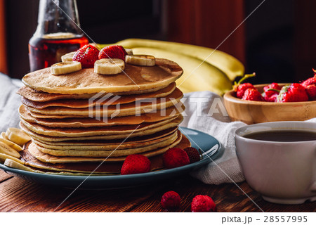 Pancakes with Tea Cup and Fruits. 28557995
