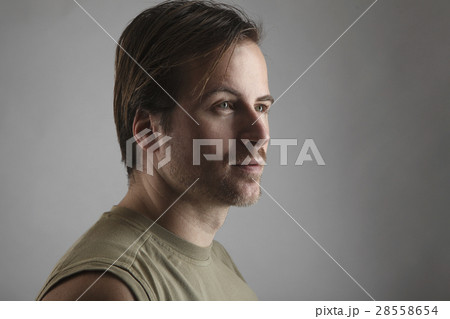 Portrait of an attractive man with green shirt 28558654