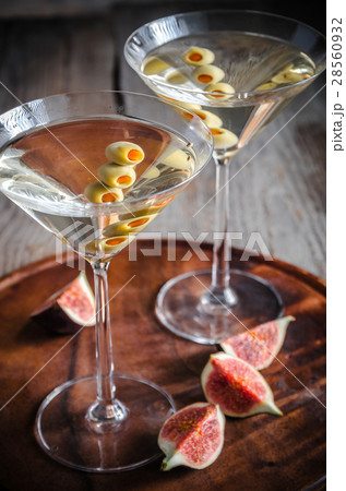 Two olive martini cocktails 28560932