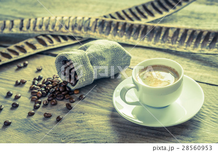 Cup of coffee with coffee beans 28560953
