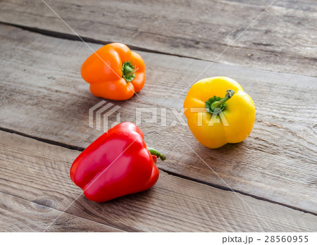 Bell peppers on the wooden background 28560955