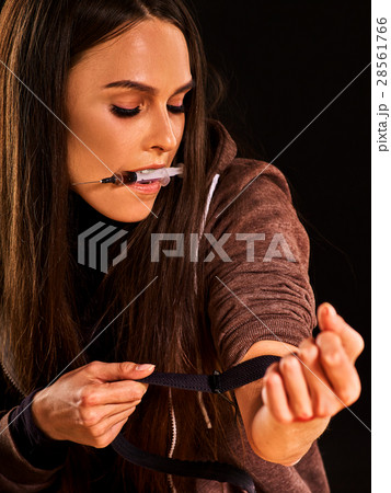 Heroin needle in addict narcotic woman's hand 28561766