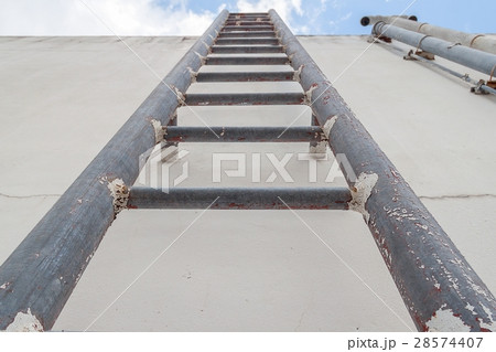 Old iron ladder upto the blue sky with cloud Old iron ladder upto the blue sky with cloud 28574407