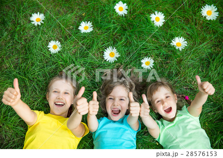 Group of happy children playing outdoors Group of happy children playing outdoors 28576153