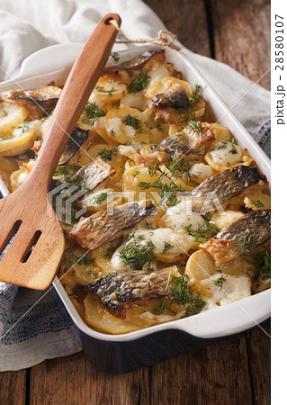 casserole of potatoes, herring fish 28580107