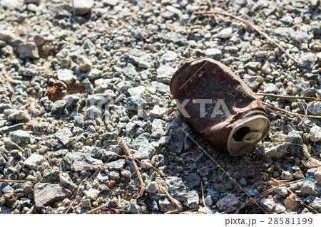 dirty rusty can on ground 28581199