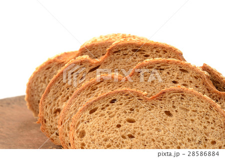 sliced loaf of bread on a cutting board  28586884