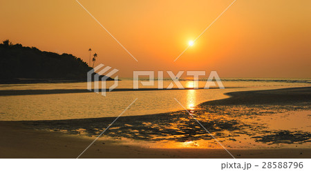 Bright tropical sunset at low tide in Goa, India 28588796