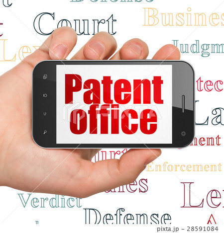 Law concept: Hand Holding Smartphone with Patent Law concept: Hand Holding Smartphone with Patent 28591084