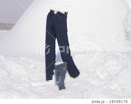 Frozen standing jeans in snow 28598176