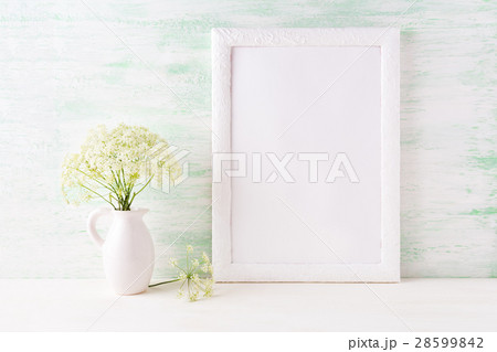 White frame mockup with delicate wild field flower White frame mockup with delicate wild field flower 28599842