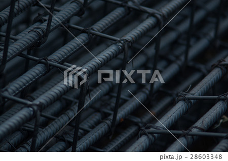 Bending rebar cut and tied together to make a post Bending rebar cut and tied together to make a post 28603348