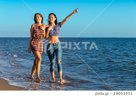 Pretty girl has a fun with her girlfriend on the Pretty girl has a fun with her girlfriend on the 28603431