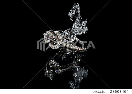Wedding Rings Sinking in Water, Black Background Wedding Rings Sinking in Water, Black Background 28603464