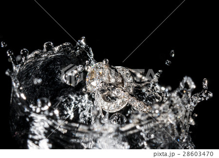 Wedding Rings Sinking in Water, Black Background 28603470