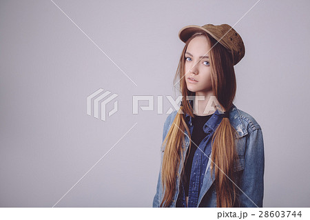 Closeup fashion studio portrait of hipster young Closeup fashion studio portrait of hipster young 28603744