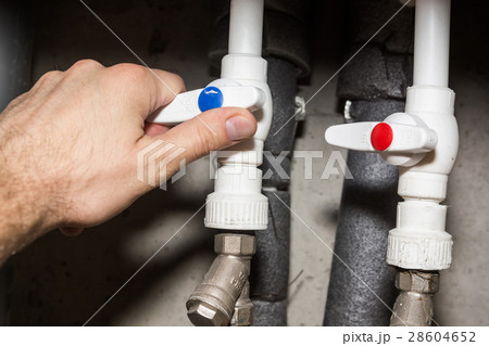 Plumber hand and plastic tap valves 28604652