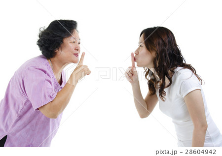 Mother and daughter finger on lips 28604942