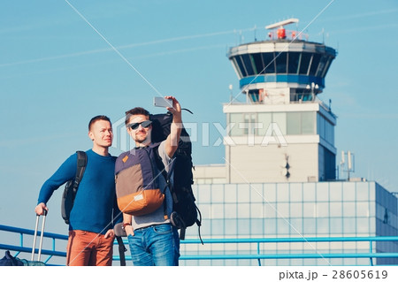 Travelers taking a selfie at the airport 28605619