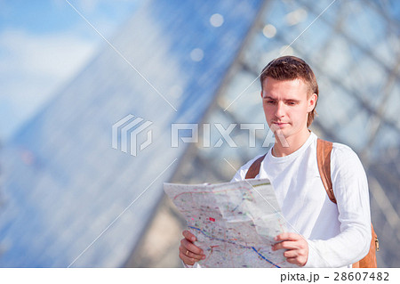 Young tourist man with map in european city 28607482