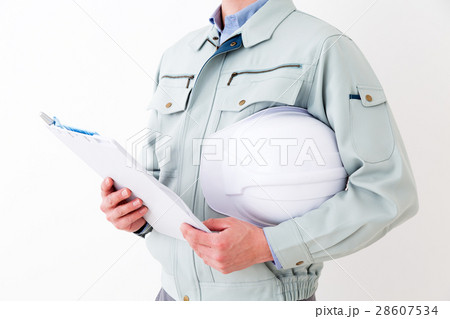 ビジネスマン 作業着 白バックの写真素材