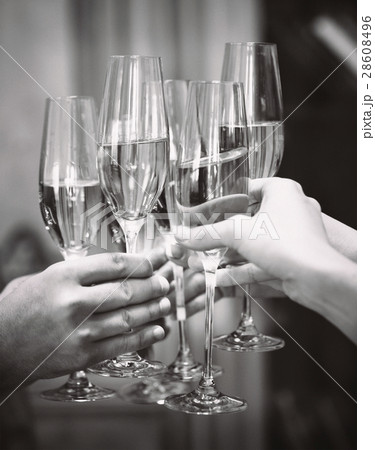 People holding glasses of champagne making toast. People holding glasses of champagne making toast. 28608496