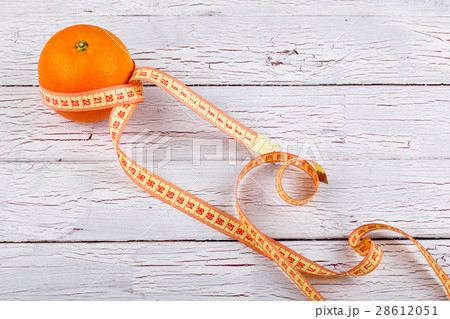 The centimeter stands near orange 28612051