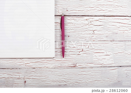 The notebook and pen stand on the table The notebook and pen stand on the table 28612060