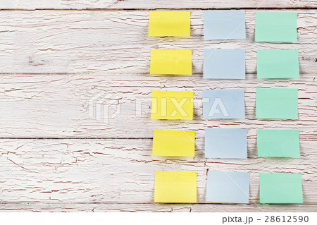 Yellow, blue and green stickers pinned Yellow, blue and green stickers pinned 28612590