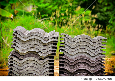 Place the stacked roof tiles 28625706