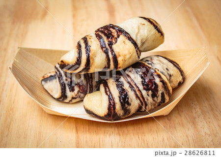 Fresh tasty croissants on wooden background. Fresh tasty croissants on wooden background. 28626811