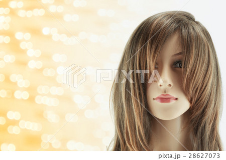 mannequin head fake with wig on bokeh background mannequin head fake with wig on bokeh background 28627073