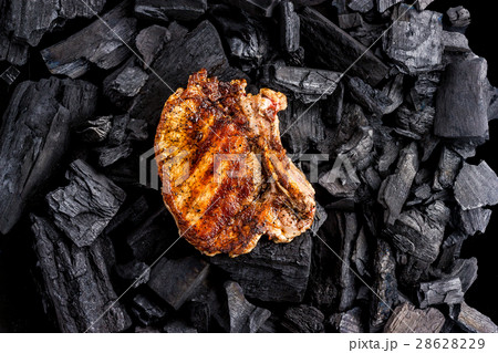 Grilled meat on the coals background 28628229