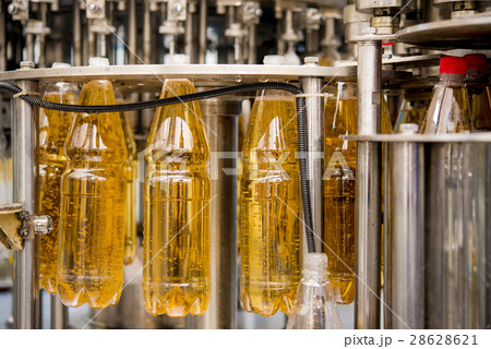 Filling bottles with juice 28628621
