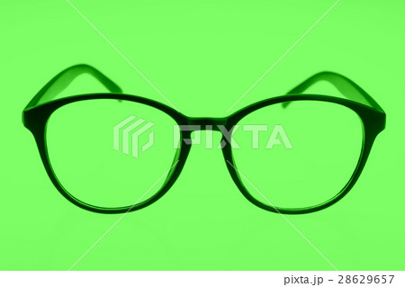 Eyeglasses isolated on green Eyeglasses isolated on green 28629657