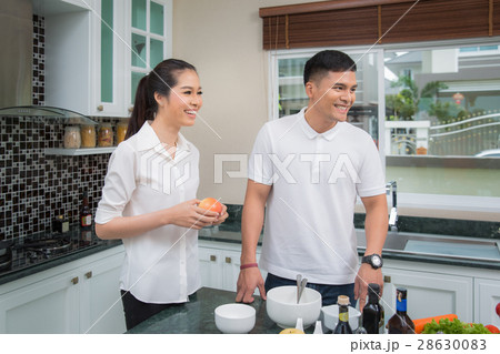 Family just married in kitchen room 28630083