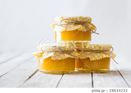 Orange marmalade on white table Orange marmalade on white table 28634232