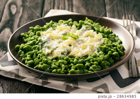 German dumplings (spaetzle) with spinach,cheese. 28634985