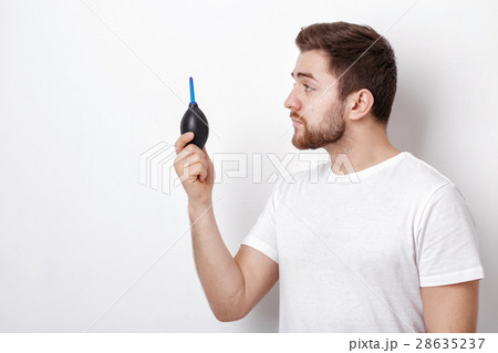 photographer holding camera cleaning vacuum pump 28635237
