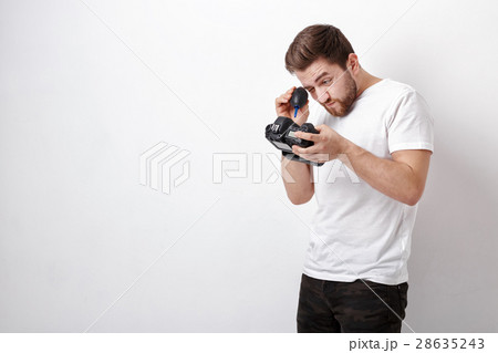 photographer cleaning camera with vacuum pump photographer cleaning camera with vacuum pump 28635243