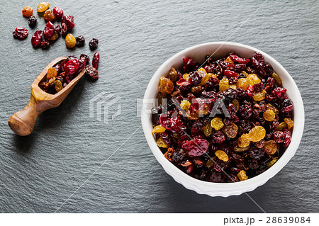 Yellow and black raisins and dried red cranberry Yellow and black raisins and dried red cranberry 28639084