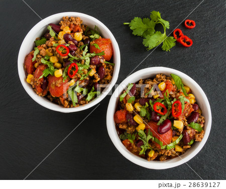 Chili con carne in a white ceramic bowl Chili con carne in a white ceramic bowl 28639127