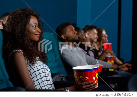 Young African woman watching a movie 28643917