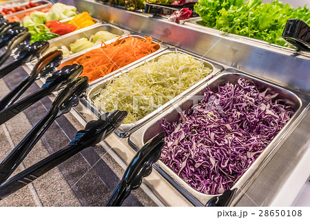 Salad bar with vegetables in silver trays Salad bar with vegetables in silver trays 28650108