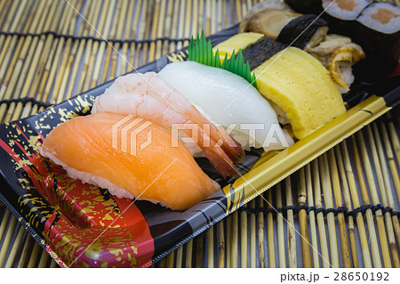 Sushi set sashimi and rolls served plate Sushi set sashimi and rolls served plate 28650192