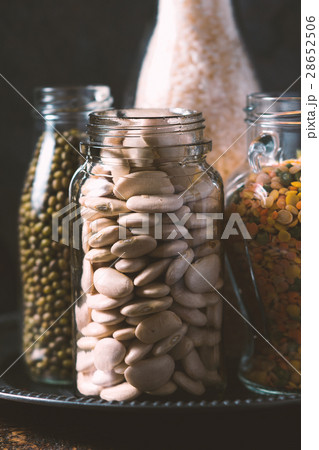Rice, lentils, white beans in bottles side view 28652506
